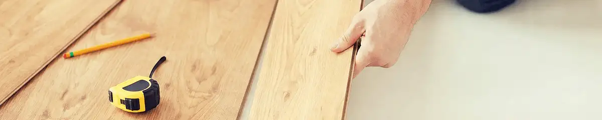 A professional installing wood flooring in Savannah, GA