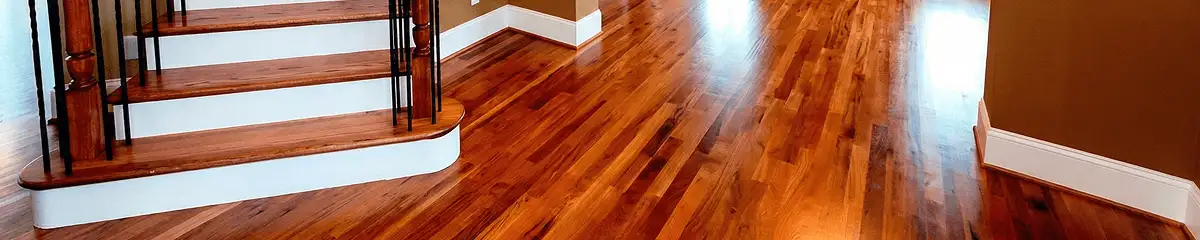 Base floor of a staircase with professionally restored wood flooring in Savannah GA