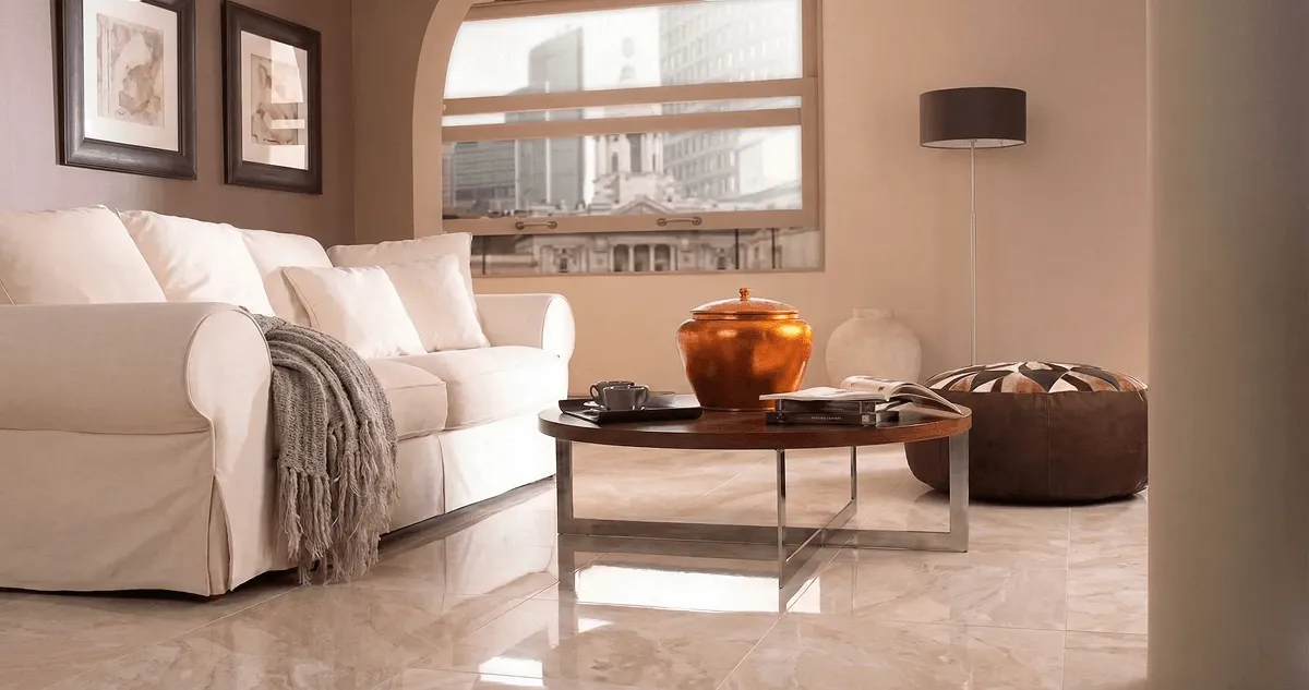 Modern living room with professionally installed marble flooring, a beige sofa, coffee table in Savannah, GA