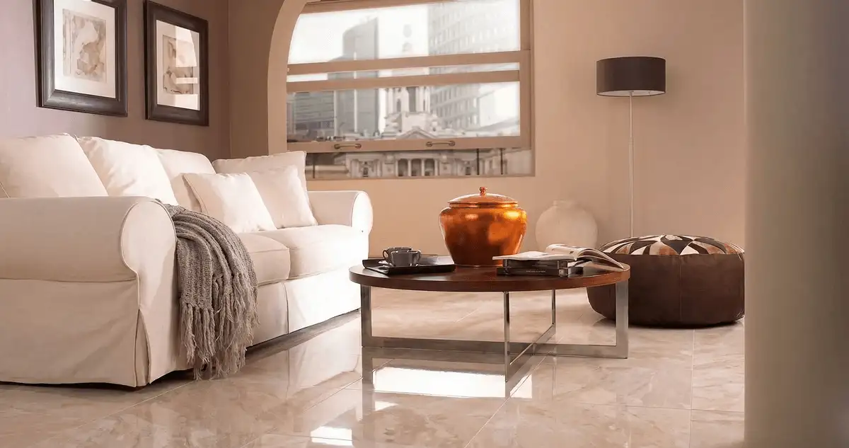 Modern living room with professionally installed marble flooring, a beige sofa, coffee table in Savannah, GA
