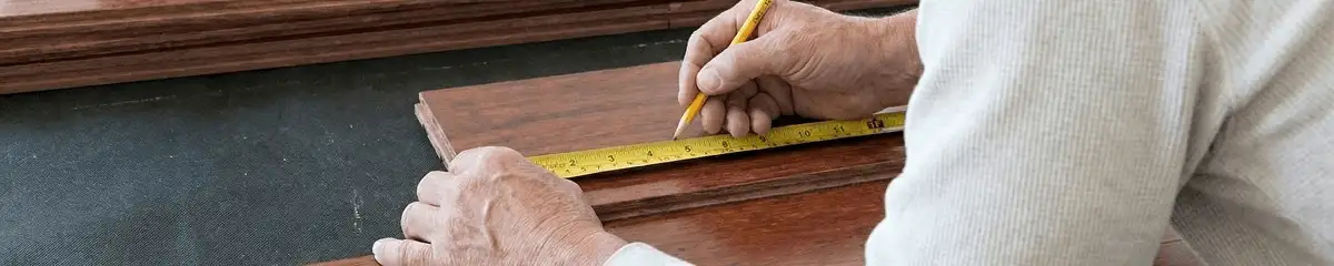 A professional installing wood flooring in Savannah, GA