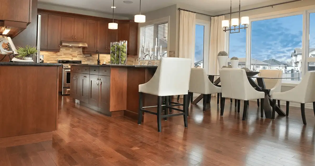 A modern kitchen with professionally installed wood flooring in Savannah, GA